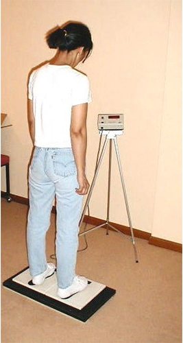 Patient standing on a bilateral weight scale